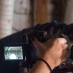 Meghan Ciafre and Analisa Johnson prep a camera on the set of "Seventeen" (FA18 • ART467)